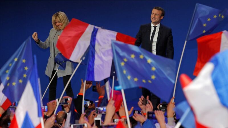 Celebrating: Emmanuel Macron, head of  political movement En Marche! (Onwards!), and candidate for the 2017 French presidential election,  on stage with his wife Brigitte Trogneux to speak at the Parc des Expositions hall in Paris after early results in the first round of the 2017 French presidential election. Photograph: Philippe Wojazer/Reuters