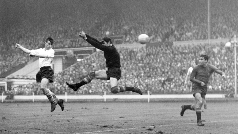 England’s Bryan Douglas  beats Spanish goalkeeper Ramalletts to score his side’s second goal  in the first ever floodlit international match at Wembley. Photo: Mirrorpix via Getty Images