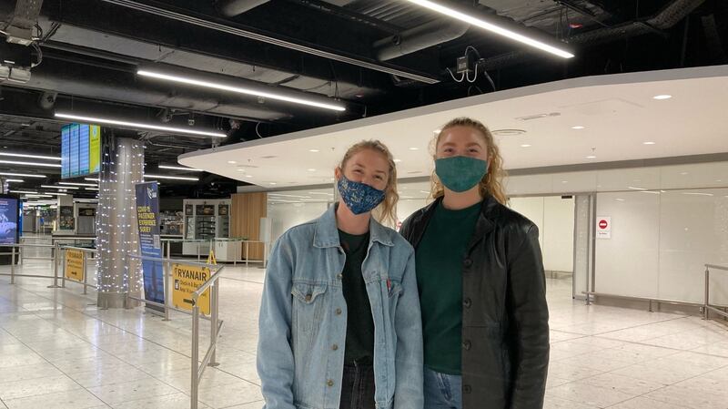 Sisters Tara (left) and Rohmie Vigurs from Co Clare, arrived into Dublin from Malaga, Spain.