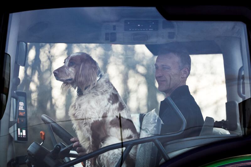 A French farmer and a friend arrive at Chambly, north of Paris, amid nationwide protests on Monday. Photograph: Sameer Al-Doumy /AFP via Getty Images