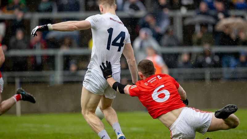 Louth’s Niall Sharkey fouls Kildare’s Daniel Flynn, leading to a penalty. Photograph: Morgan Treacy/Inpho