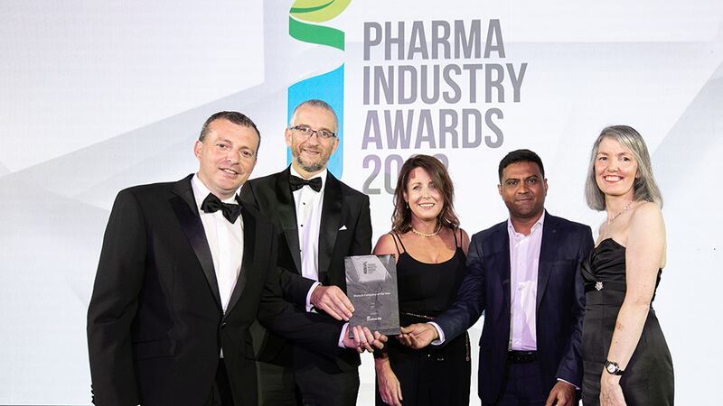 Tom Tobin, Sales Director, Micro-Bio, presents the Biotech Company of the Year award to the APC team.