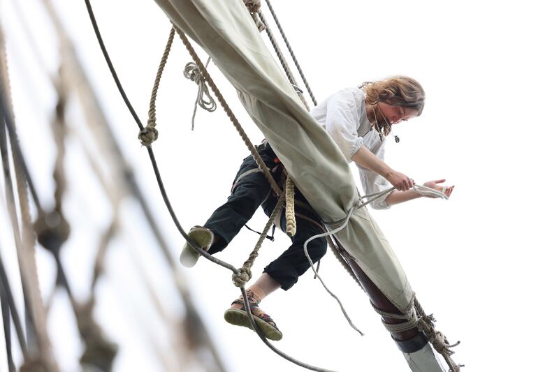 A crew members on the Shtandart, a replica of a ship built by Russia's Tsar, Peter the Great, in 1703. It was built in 1999 and describes itself as 'sail training ship', under the flag of the Cook Islands. Photograph: Dara Mac Dónaill









