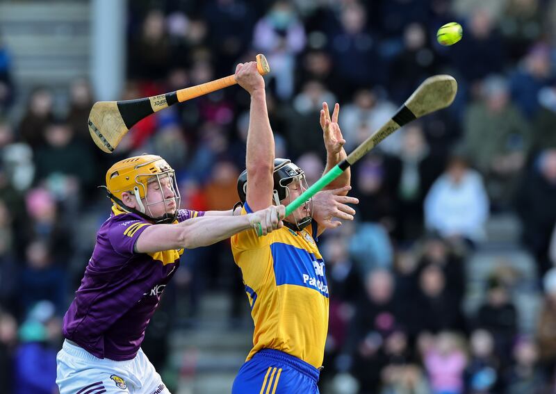 Wexford's Simon Donohoe and David Reidy of Clare. Photograph: Lorraine O’Sullivan/Inpho