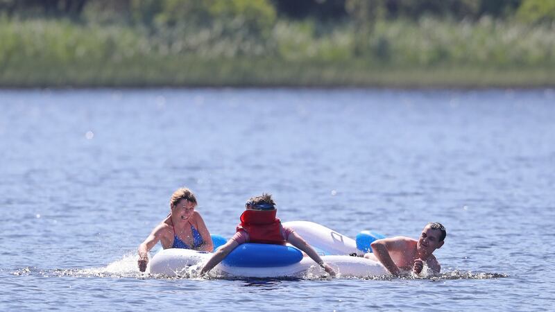 People enjoying the hot weather at Glendalough in Co Wicklow. Photograph: PA