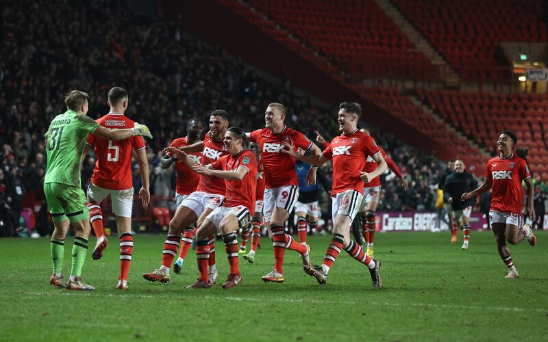 Charlton players celebrate after Sam Lavelle scores the winning penalty in the shootout. Photograph: Steven Paston/PA