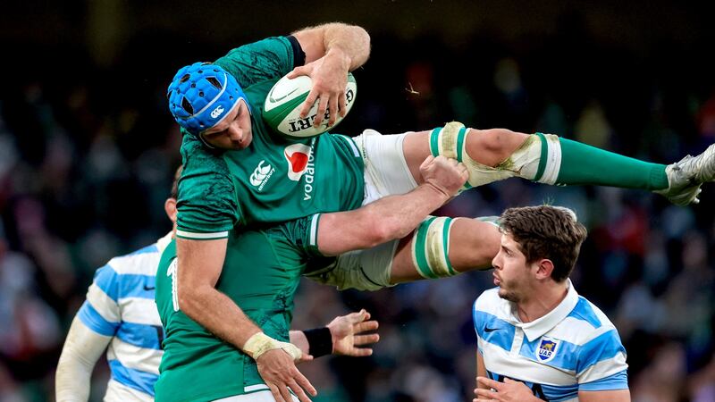 Tadhg Beirne is brought down from the air by Cian Healy. Photo: Billy Stickland/Inpho