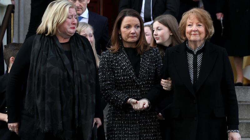 Kathleen Watkins (right), wife   broadcaster Gay Byrne with their daughters Crona (left) and Suzy leaving St Mary’s Pro-Cathedral in Dublin following his funeral service. Photograph: Brian Lawless/PA Wire