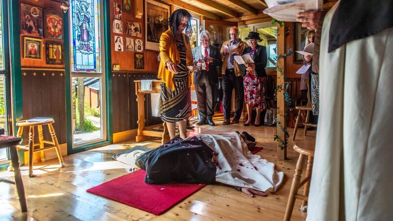 Flowers are laid on Sr Anne Marie as she makes a public profession of simple vows as a Carmelite Nun at Holy Family Carmelite Hermitage, in Leap, Co Cork.  Photograph: Michael Mac Sweeney/ Provision