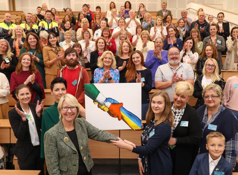 Prof Eeva Leinonen, president of Maynooth University, and Dr Gemma Irvine, vice-president for Equality & Diversity, with artist Oleksandra Atamanenko (16), her family and the wider Maynooth Ukrainian Action Group
