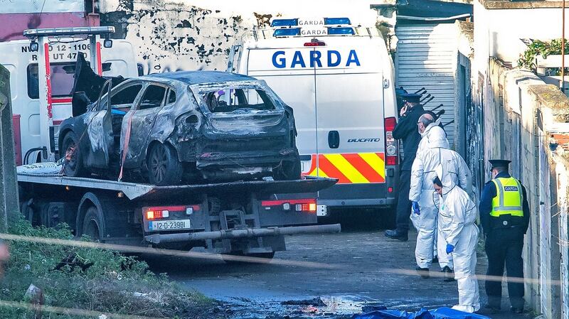 Gardai remove the burnt out vehicle on Trinity Terrace, Drumcondra, where parts of Keane Mulready Woods’ body  were found in a burned out car. Photograph: Colin Keegan/Collins Dublin