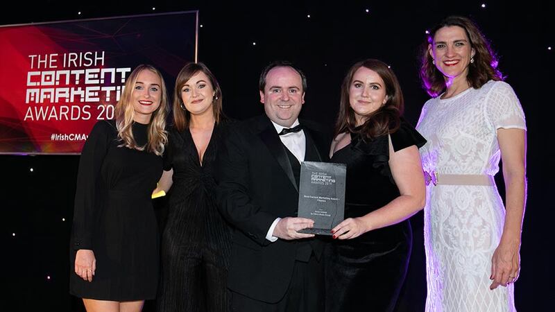 Brendan Maguire, Awards Judge presents the Best Content Marketing Award - Finance to Aviva & Zahra Media Group Teams.
