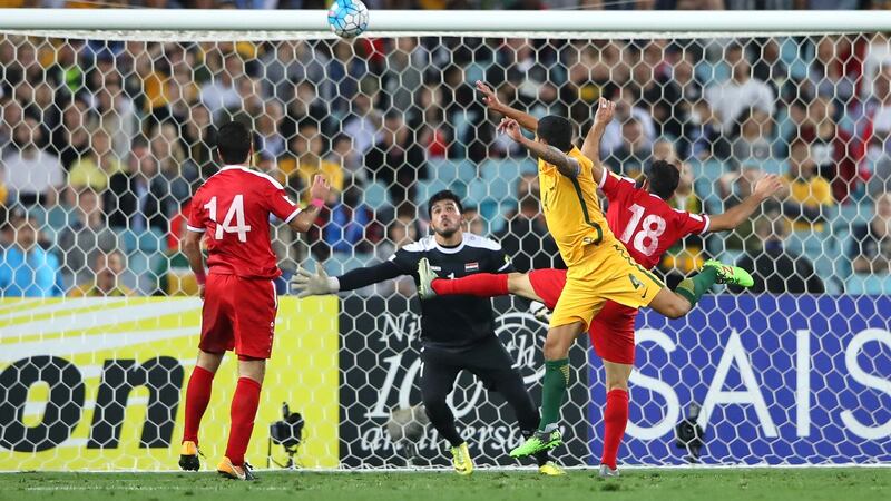 Tim Cahill scores during Australia’s Asian playoff win over Syria. Photograph: Cameron Spencer/Getty
