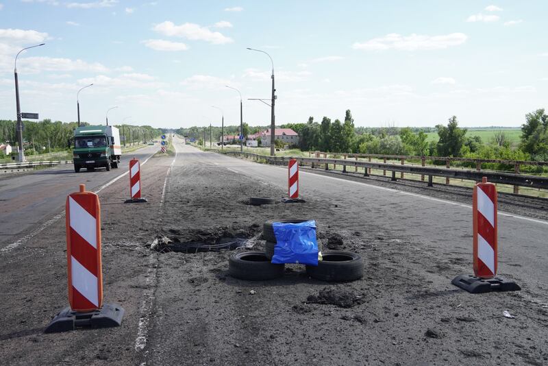 Craters on Kherson's Antonivskyi bridge across the Dnipro river caused by a Ukrainian rocket strike last week. Photograph: Stringer/AFP via Getty Images