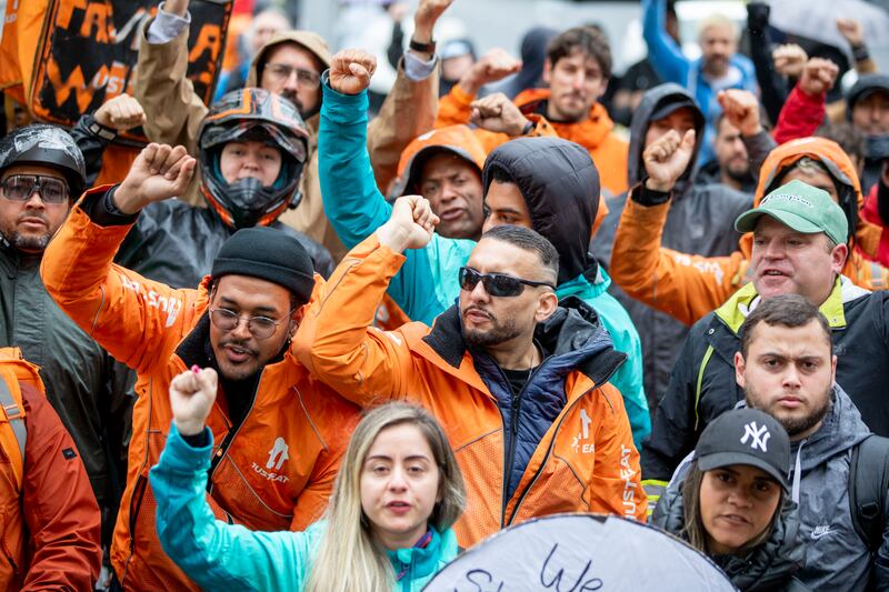 Delivery riders gather to highlight low pay and work safety concerns on O’Connell Street, Dublin, in July 2023. Photograph: Tom Honan 