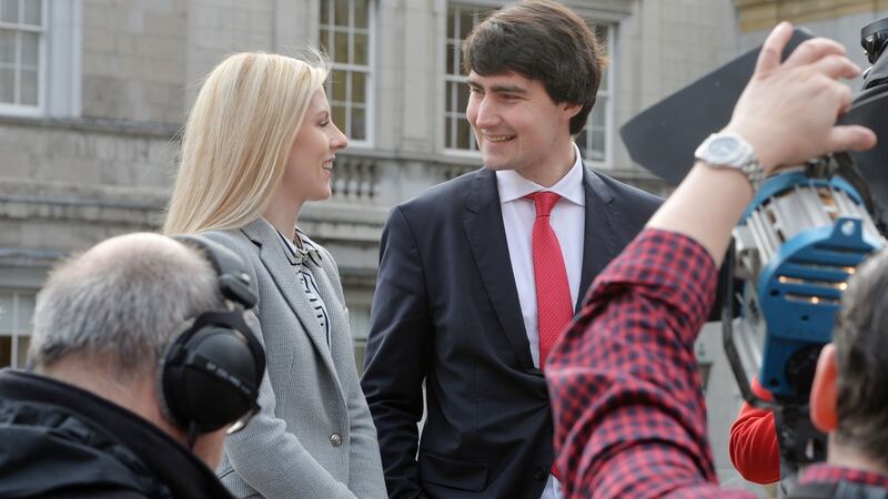Newly elected Fianna Fáil TDs Lisa Chambers and Jack Chambers on the plinth ahead of the first meeting of the 32nd Dáil at Leinster House. Photograph: Alan Betson/The Irish Times.