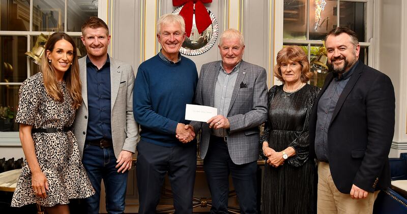 Bill Cuddihy, chairman of the Cois Nore Cancer Support Centre, receives a cheque for €3,500 from Richie Power Snr from the proceeds of Power, A Family Memoir. Also pictured are Maria Connolly, Richie Power Jnr, Ann Power and book author Dermot Keyes.