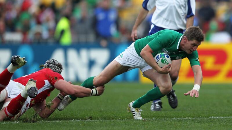 Ronan O’Gara is tackled by Dan Lydiate during Ireland’s defeat to Wales. Photograph: Billy Stickland/Inpho