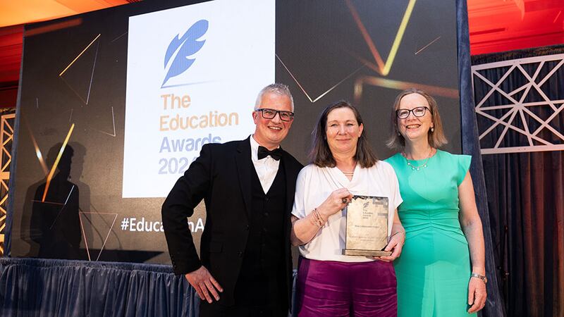 Tomas Finneran, awards judge, presents the best collaboration project award to professor Frances Heaney and professor Denise Rooney, Virtual Labs team