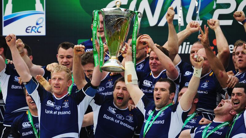 Leo Cullen, left, and Shane Jennings, right, lift the Heineken Cup trophy after victory over Ulster at Twickenham in May 2012. Photograph:  Stu Forster/Getty 