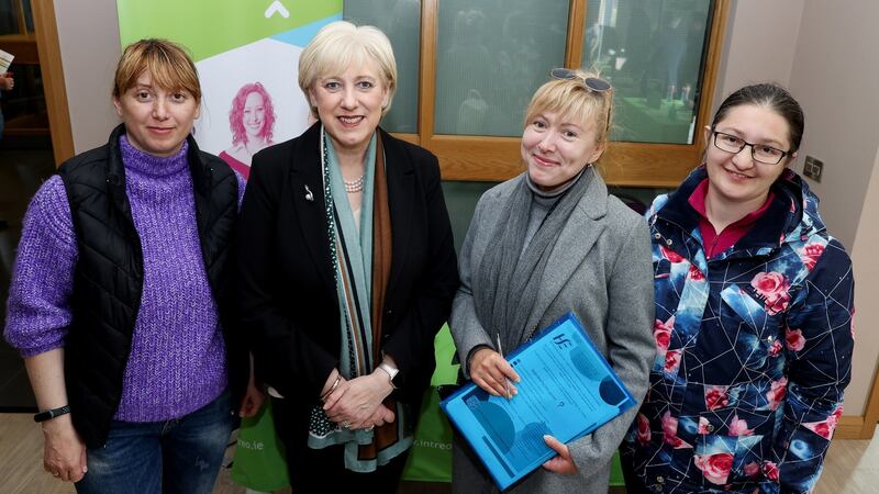 Minister for Social Protection Heather Humphreys TD with Ukrainian nationals, Mariia Maksymova, Maryna Rosahata and Alentyna Rekruckenko at a jobs recruitment fair in Dublin in April. Photograph: Maxwells Dublin