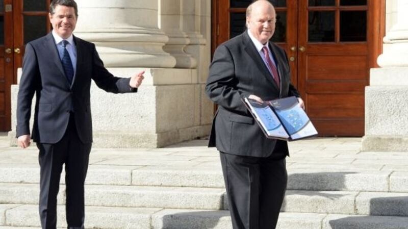 Minister for Public Expenditure and Reform Paschal Donohoe and Minister for Finance Michael Noonan at a photocall to present Budget 2017 at Government Buildings. Photograph: Eric Luke/The Irish Times