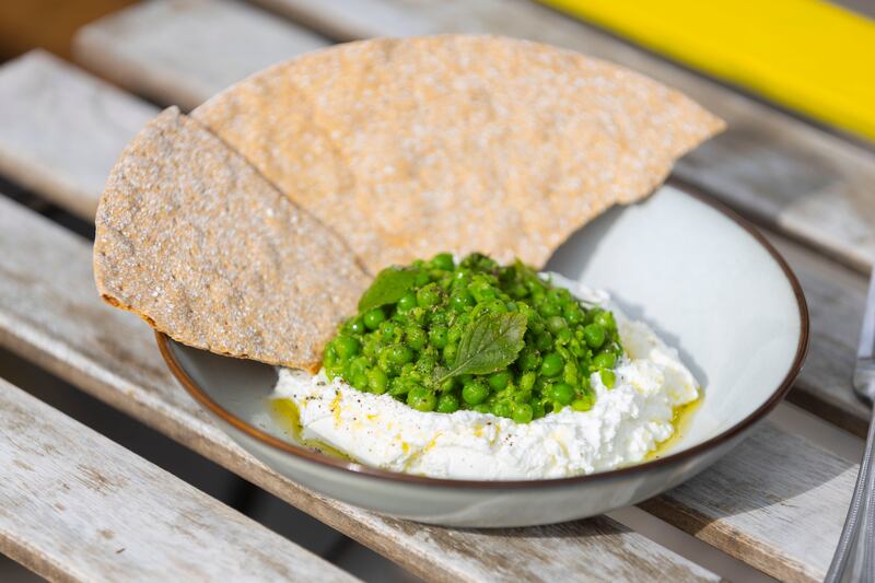 St Tola goat's curd with crushed lemony minted peas, McNallys lemon balm and crisp bread. Photographs: Patrick Browne