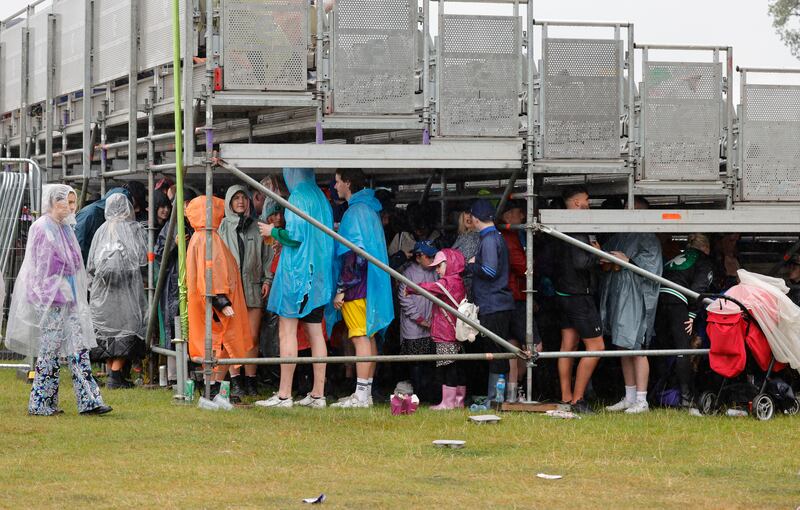 Electric Picnic 2022: sheltering from the rain on Saturday. Photograph: Alan Betson