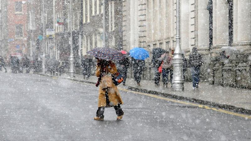 Pedestrians struggle through the snow on  Merrion Square in Dublin last week. Photograph: Dave Meehan/The Irish Times
