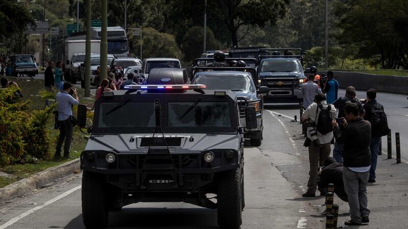 Members of the Bolivarian Armed Forces head to the location of an operation against a rebel group in the El Junquito neighbourhood of Caracas, Venezuela, on Monday. Photograph: Miguel Gutierrez/EPA