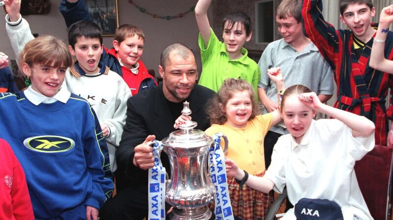 Paul McGrath and the FA Cup with young patients in our Lady’s Hospital for Sick Children in July 2002. Photograph: Paddy Whelan