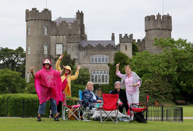 Book club friends from Naas enjoy the view and acoustic overspill from the grounds of Malahide Castle. Photograph: Alan Betson/The Irish Times

