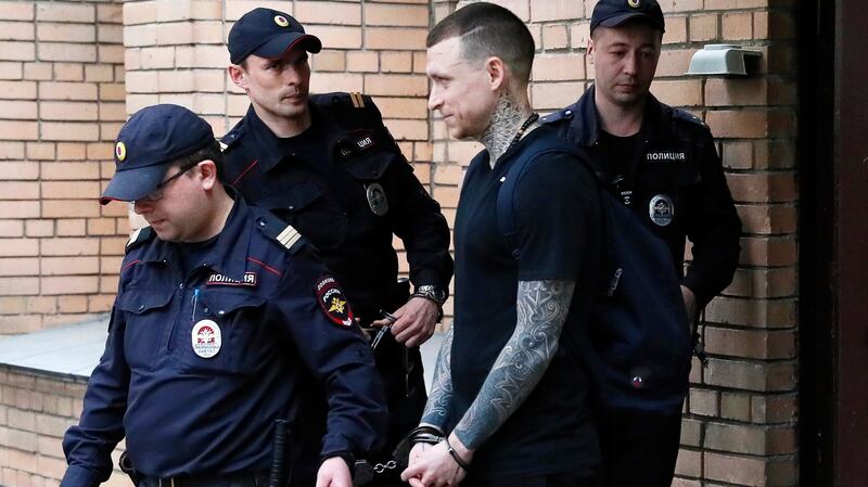 Russian soccer player Pavel Mamayev  is escorted after the verdict announcement at the Presnensky District Court in Moscow. Photograph: Maxim Shipenkov/EPA