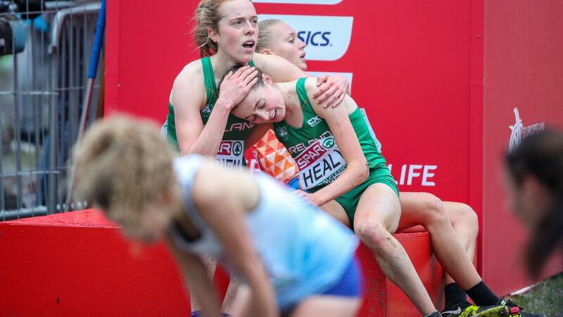 Ireland’s Niamh O’Brien consoles Sarah Healy after the Women’s under-20 race. Photo: Bryan Keane/Inpho