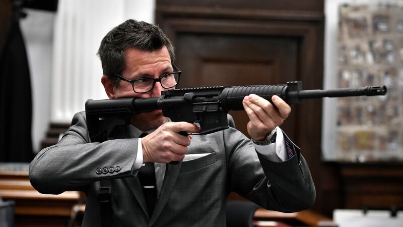 Assistant district attorney Thomas Binger holds Kyle Rittenhouse’s gun as he gives the state’s closing argument in court on Monday. Photograph: Sean Krajacic/The Kenosha News via AP, Pool