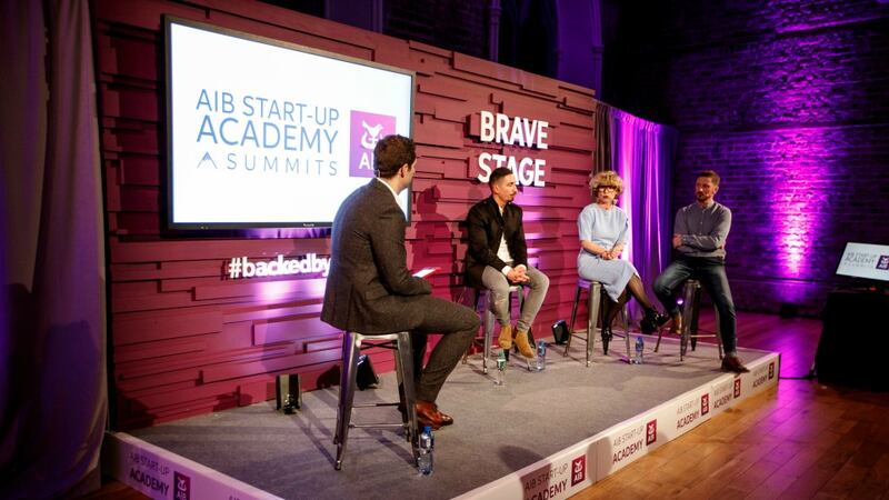 Presenter Jonathan McCrea speaks to expert panellists Sonya Lennon, Niall McGarry and John Kavanagh at the Dublin AIB Start-up Summit in Smock Alley