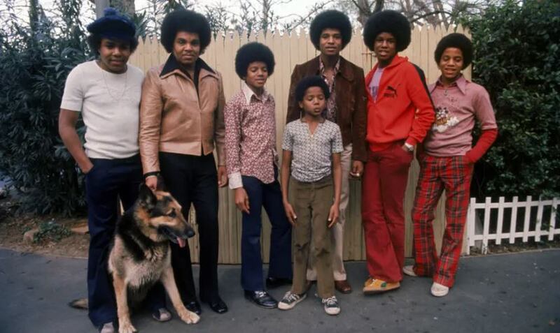 The Jacksons with their father Joe in their backyard, 1972: (left to right) Tito, Joe, Michael, Randy, Jackie, Jermaine and Marlon. Photograph: Getty Images