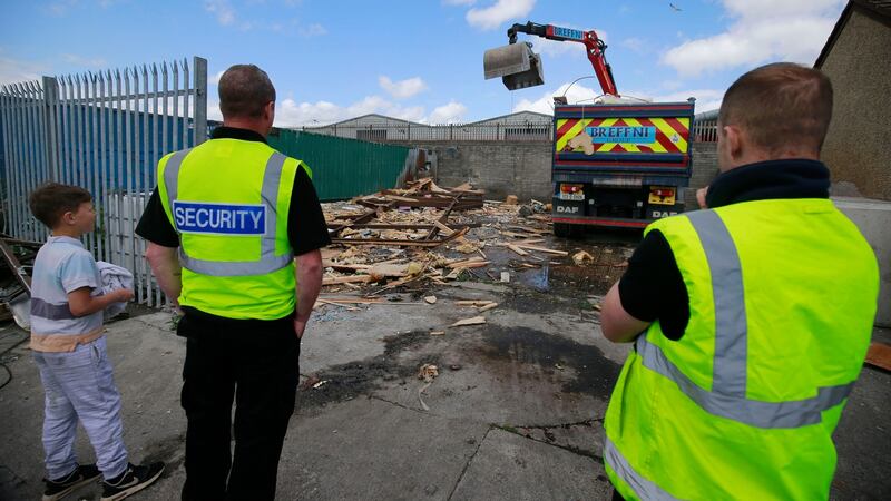 Tommy Connors (11) looks on as the site is cleared by council staff and contractors. Photograph: Nick Bradshaw