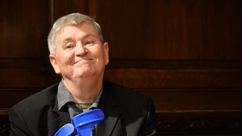 A beloved figure:  Philip Casey listening to poetry readings at his 65th birthday at the Mansion House. Photograph: Sara Freund