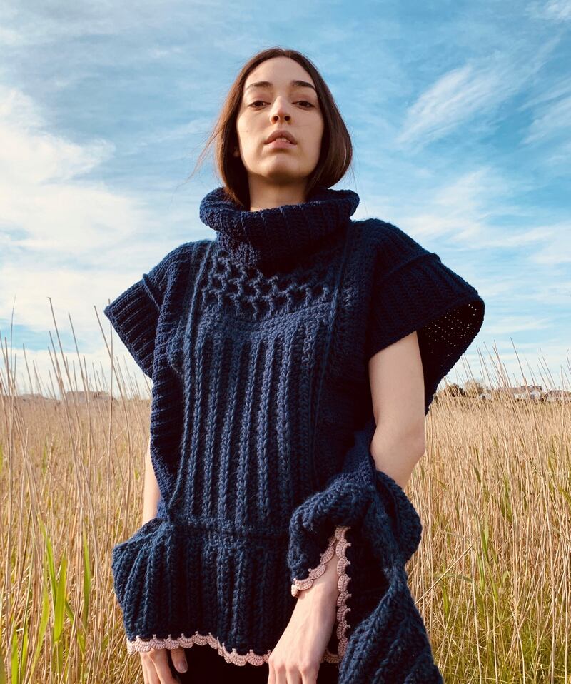 Sleeveless hand-crochet Merino wool sweater in waffle stitch trimmed with blush pink ribbon yarn, €995.