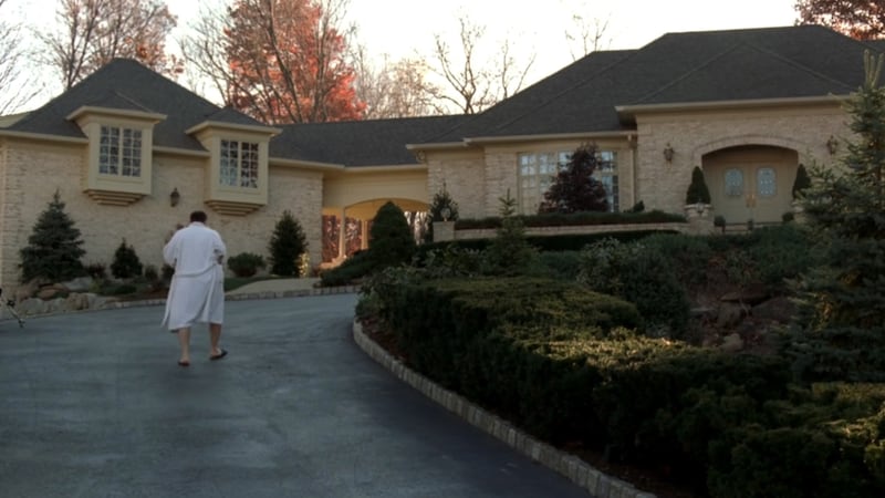 The actor James Gandolfini, in character as Tony Soprano, ascends the driveway of his McMansion in North Caldwell, New Jersey. Photograph: HBO/The New York Times