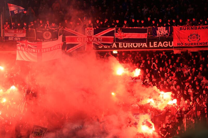 Rangers supporters burn flares during the game in Malmo. Photograph: Andreas Hillergren/AFP via Getty Images