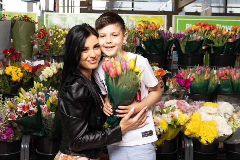 Mother-of-one Denisa Baltatu, Lidl Ireland’s employer brand specialist, with her son Nathan at the flower section of the Greystones store