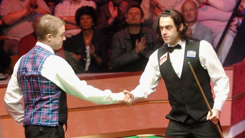 Stephen Hendry congratulates Ronnie O’Sullivan after his semi-final defeat in the 2004 World Championships. Photograph: Matthew Lewis/Getty