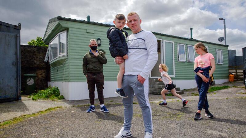 Kieran McCarthy with his son Kieran and extended family at Spring Lane halting site in Cork city. Photograph:  Daragh McSweeney/Provision