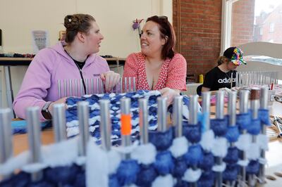 Emma Byrne, weaving instructor, with Grace and Kerri using peg looms  at the Childvision Campus. Photograph: Alan Betson 