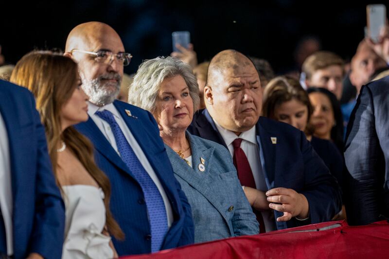 Susie Wiles (centre), one of Donald Trump’s top political advisers, listens to the former president during a campaign event at his Bedminster Golf Club in New Jersey. Photograph: Doug Mills/New York Times
                      