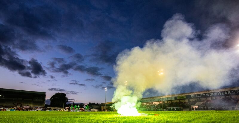 Shamrock Rovers fans throw a flare onto the field. Photograph: Evan Treacy/Inpho