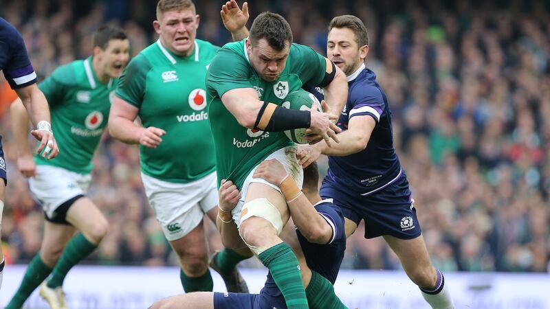 Ireland’s Cian Healy is tackled by Scotland’s Greig Laidlaw and Huw Jones.  Photograph:  Tom Honan/The Irish Times