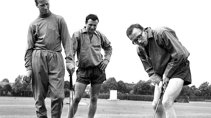 Stiles is pictured playing golf with Jack Charlton (left) and Jimmy Armfield (back) in 1966. Photo: PA/PA Wire